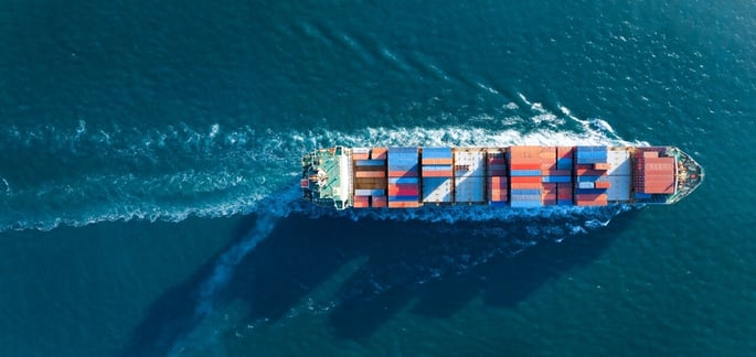 Aerial view of cargo ship with shipping containers