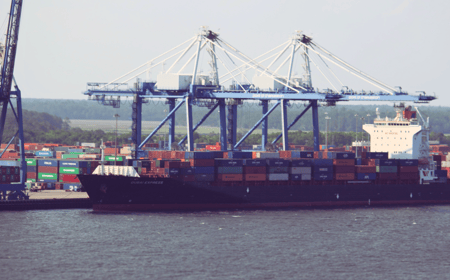 Ship in port with containers in background