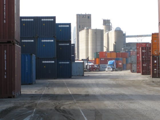 shipping containers stacked in depot