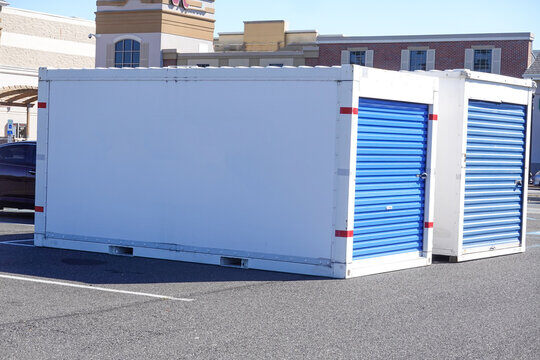 white portable storage pod unit with blue doors